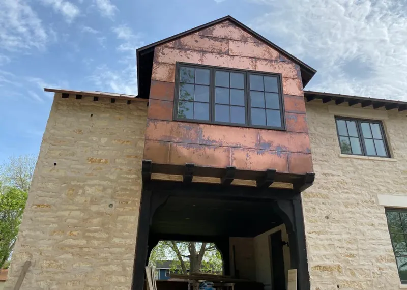 Copper metal panel facade on a stone building for Metal Roof Coating in Cathedral City