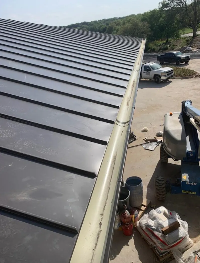 Standing seam panel and gutter detail on a metal roofing jobsite in Cathedral City
